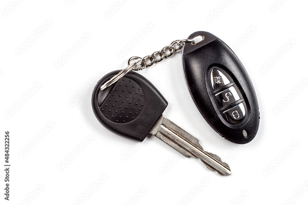 Car keys with an alarm key fob on a white background. Car keys with an alarm key fob on a white background.