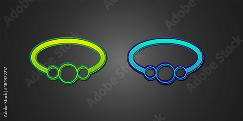 Green and blue Bracelet jewelry icon isolated on black background. Bangle sign. Vector