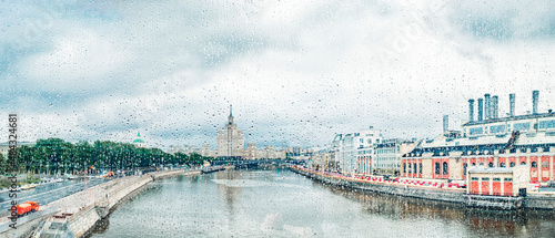 Obraz na płótnie View through glass with raindrops of The Moskva River, Kotelnicheskaya Embankment Building in Moscow, Russia w salonie