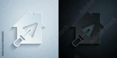 Paper cut House or home with trowel icon isolated on grey and black background. Adjusting, service, setting, maintenance, repair, fixing. Paper art style. Vector