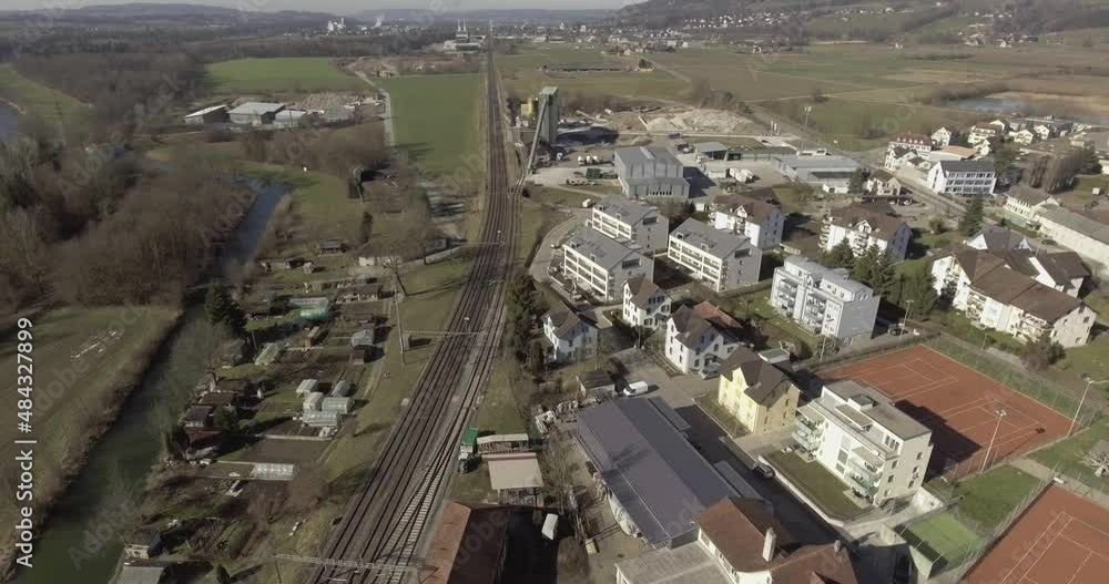 Aerial drone shot above new apartment building in a rural area. Aerial drone shot above new apartment building in a rural area.
