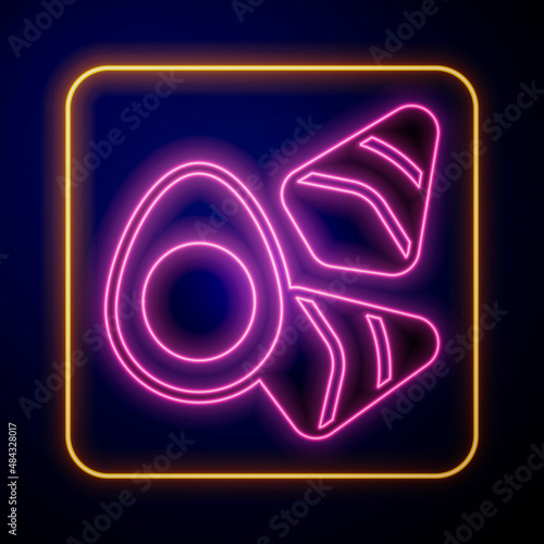 Glowing neon Chicken egg with vegerables icon isolated on black background. Vector