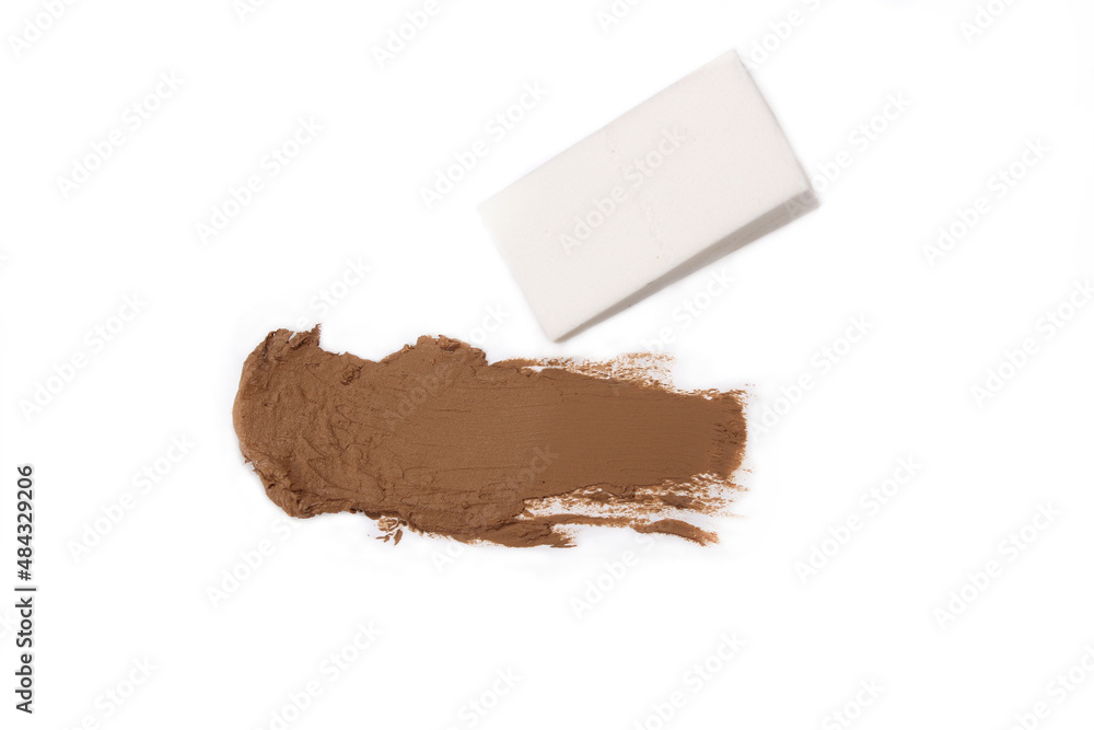 Make up Foundation Smudge on White Background With Applicator Make up Foundation Smudge on White Background With Applicator