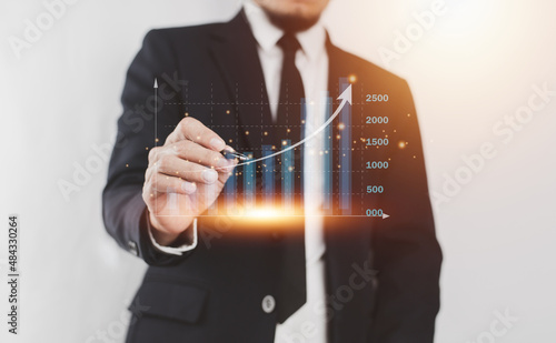 Businessman trading stock market on visual screen digital chart data analysis , Trader photo