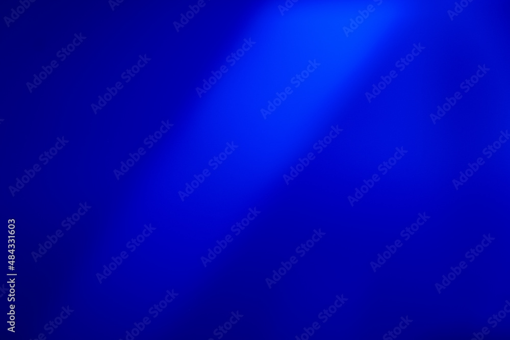 Defocused glow overlay. Neon light. Ultraviolet laser gradient. Blur blue color soft rays radiance on dark abstract empty space background.