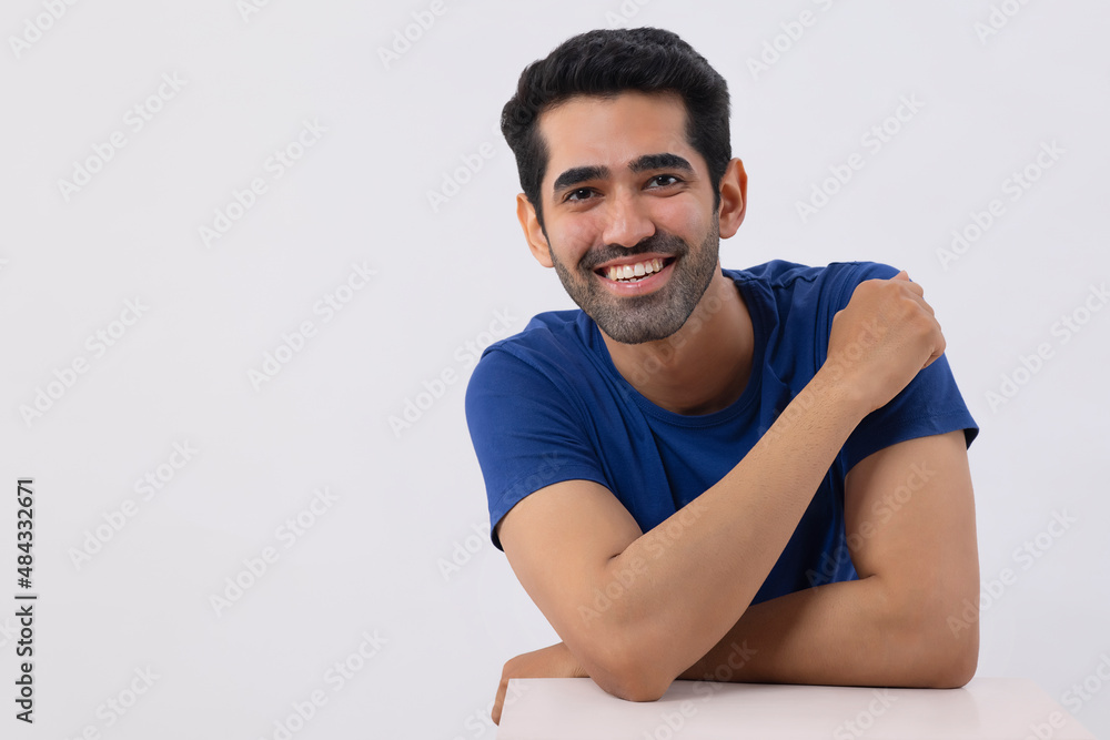 Happy young man looking at the camera with smile Happy young man looking at the camera with smile