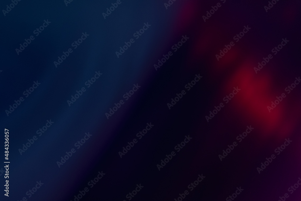 Fototapeta premium Lens flare overlay. Blur neon rays. Bokeh light leak texture. Defocused blue purple red color glow flecks on dark abstract empty space background.