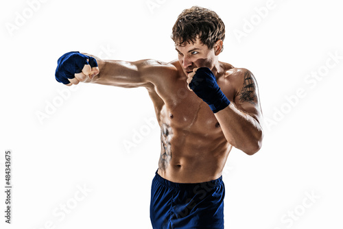 Studio shot of kickboxer who training, practicing jab on white background. Blue sportswear