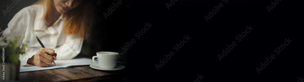 Planner write appointment to plan daily agenda calendar book. Asian Woman mark and note schedule on diary at business office desk. Work online at home concept-panoramic banner for web header. Planner write appointment to plan daily agenda calendar book. Asian Woman mark and note schedule on diary at business office desk. Work online at home concept-panoramic banner for web header.
