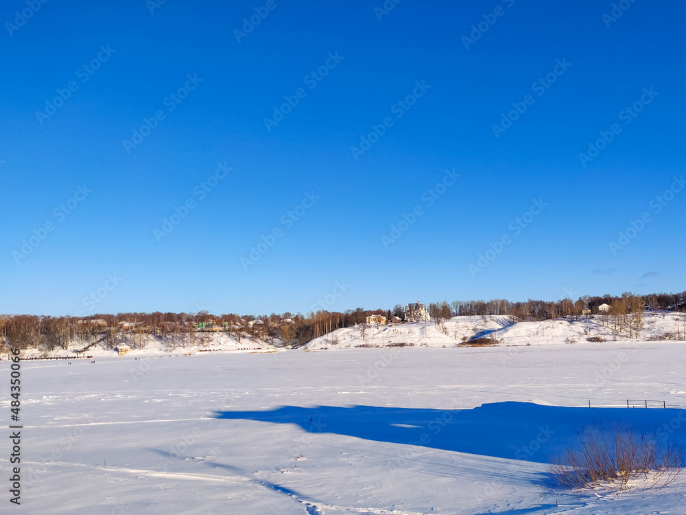 Rural Russian winter landscape with Volga river and Tutaev village