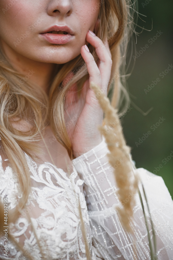 A young cute girl in a white dress poses beautifully. Positive attitude A young cute girl in a white dress poses beautifully. Positive attitude