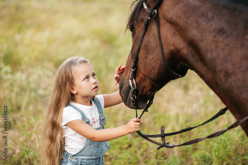 Friendship of a child with a horse. Treating autism with a horse