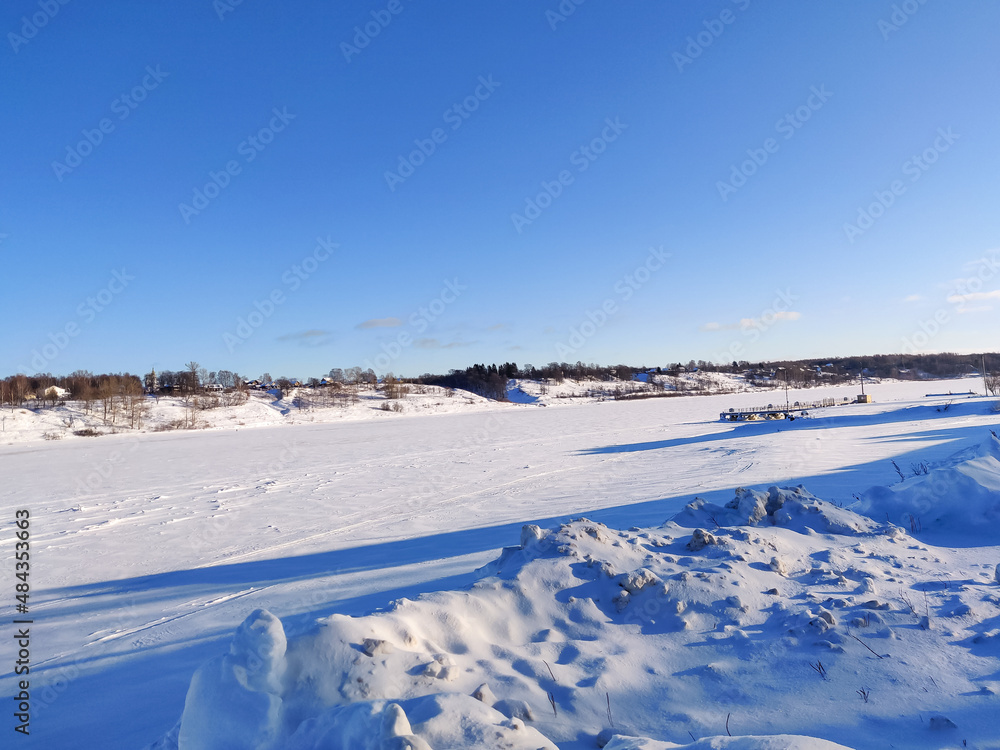 Rural Russian winter landscape with Volga river and Tutaev village