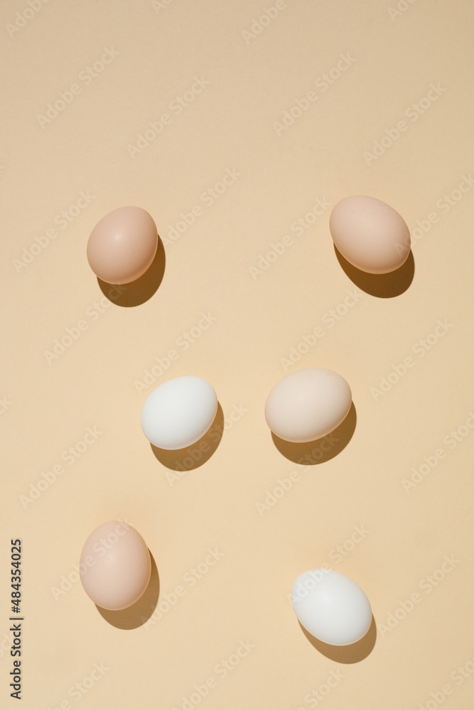 fresh eco-friendly farm chicken eggs on a beige background. Minimalistic style fresh eco-friendly farm chicken eggs on a beige background. Minimalistic style