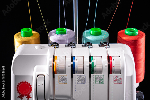 Professional overlock sewing machine with multicolored thread