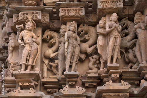 VAMANA TEMPLE :Dancer and Imaginary animal Sculpture or Vyalas , Western Group, Khajuraho, Madhya Pradesh, India photo