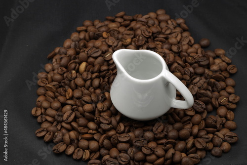 Small cup and coffee beans