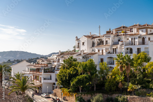 FRIGILIANA, SPAIN - January 28 2022: Situated in South of Spain, Frigiliana is a touristic travel destination, a village situated on the hills, with white houses, small roads. Typically Andalusian  photo