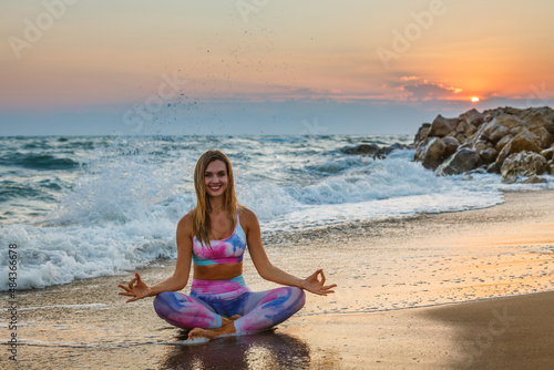 Smiling woman practicing yoga © Anna Lurye