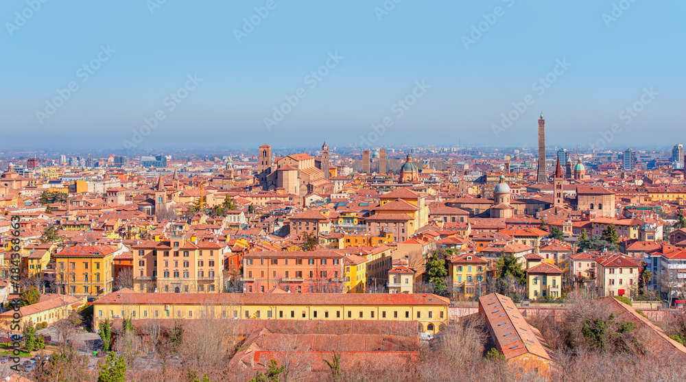 Panoramic view of red rooftops and buildings - Cityscape from above, view of Garisenda and Asinelli tower - Bologna, Italy