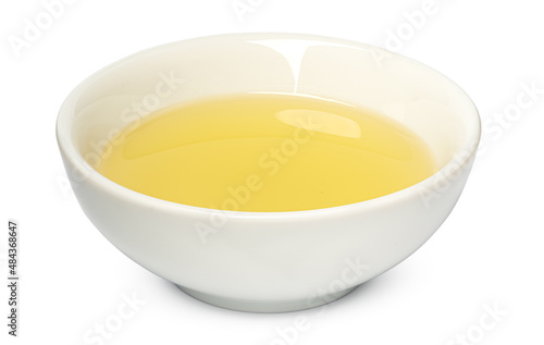 Small bowl with olive oil isolated on white background