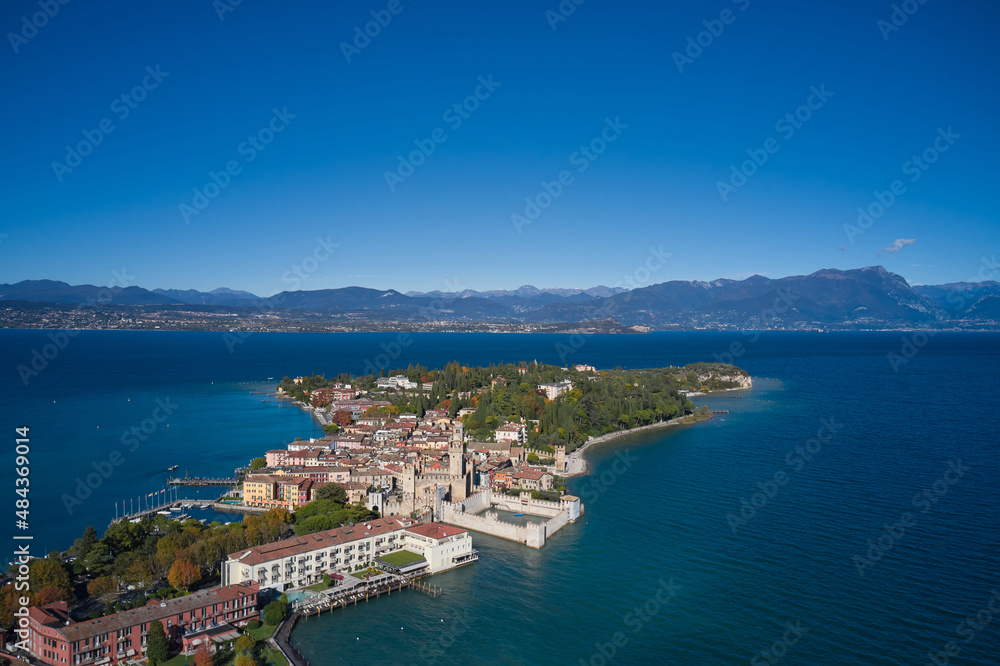 Autumn in Sirmione. Sirmione aerial view. Top view, historic center of the Sirmione peninsula, lake garda. Aerial panorama of Sirmione. Lake Garda, Sirmione, Italy. Italian castle on Lake Garda.