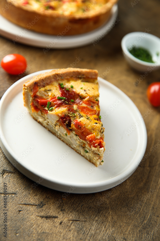 Homemade chicken quiche with tomatoes and pepper Homemade chicken quiche with tomatoes and pepper