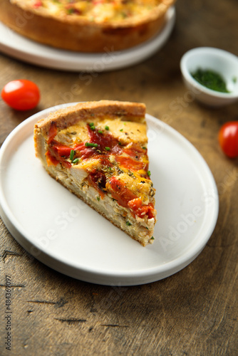 Homemade chicken quiche with tomatoes and pepper 