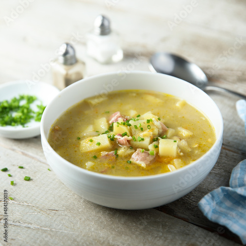 Traditional homemade pea soup with smoked bacon