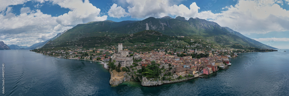 The historic town of Malcesine on Lake Garda, Italy. Castle on Lake Garda top view. Castle of Malcesine, panorama aerial view.