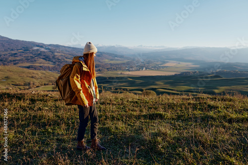 woman tourist admiring the landscape mountains nature Fresh air
