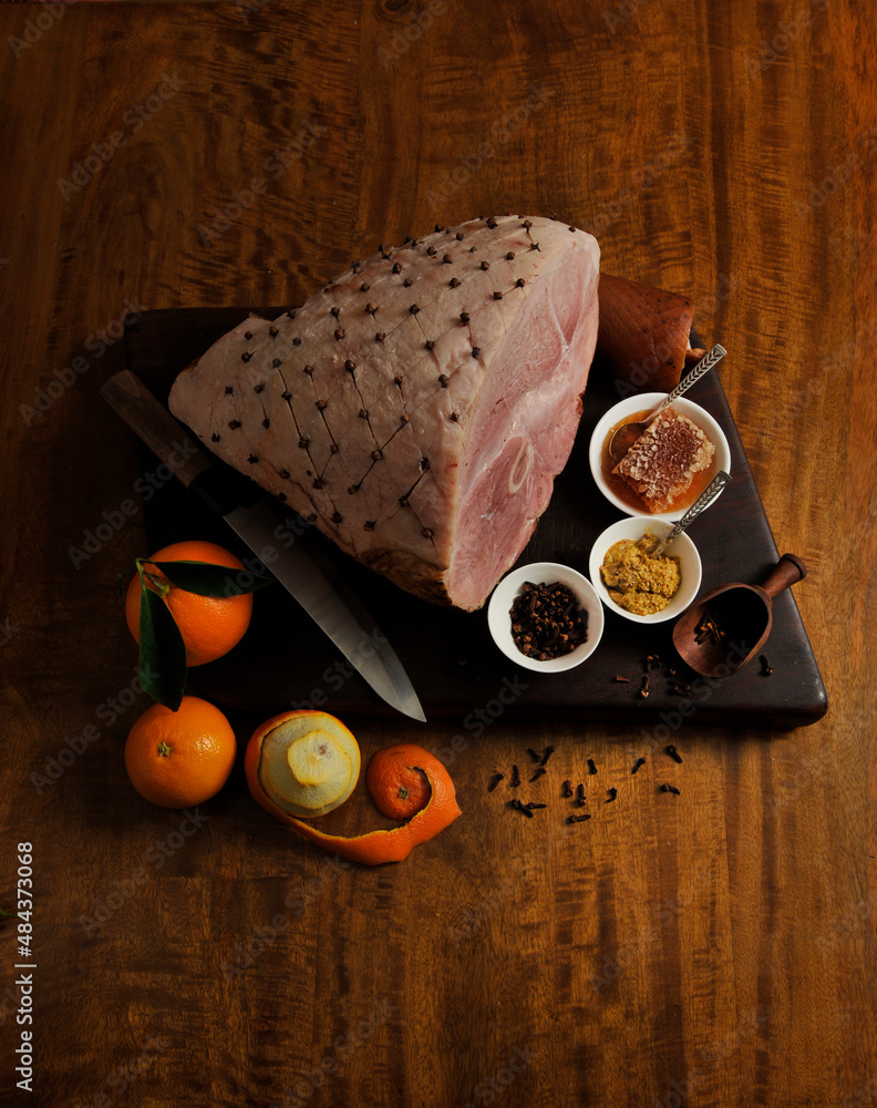 leg ham with cloves, honey, mustard, pepper, citrus glaze Stock Photo