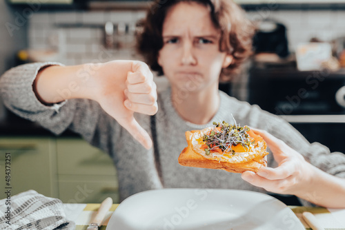 Reluctance of teenager to eat right and eat healthy food