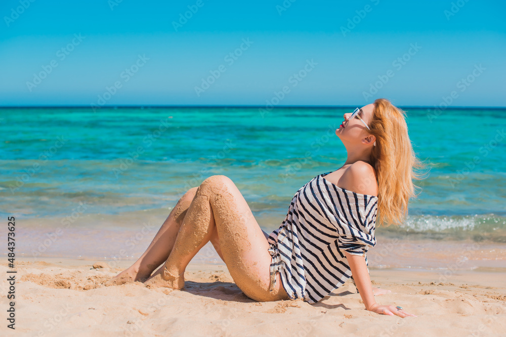 Vacation scene. Panoramic views of blue sea and coastline. Beautiful landscape, aerial view, Egypt. Plus size woman enjoys view of coast of Red Sea. High quality photo