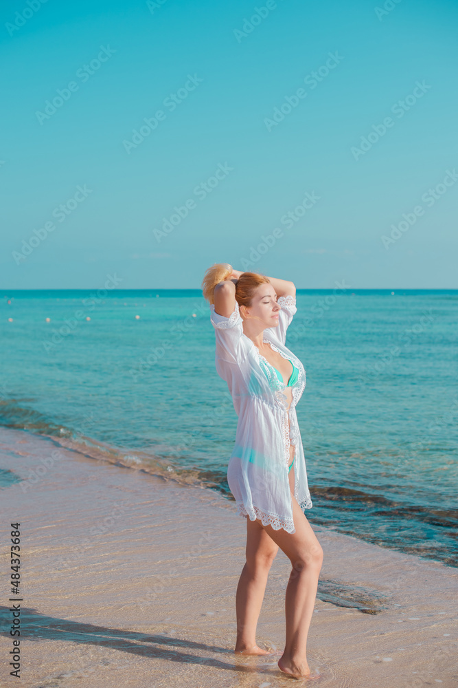 Vacation scene. Panoramic views of blue sea and coastline. Beautiful landscape, aerial view, Egypt. Plus size woman enjoys view of coast of Red Sea. High quality photo Vacation scene. Panoramic views of blue sea and coastline. Beautiful landscape, aerial view, Egypt. Plus size woman enjoys view of coast of Red Sea. High quality photo