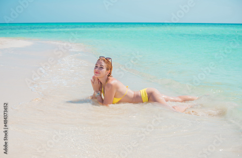 Vacation scene. Panoramic views of blue sea and coastline. Beautiful landscape, aerial view, Egypt. Plus size woman enjoys view of coast of Red Sea. High quality photo