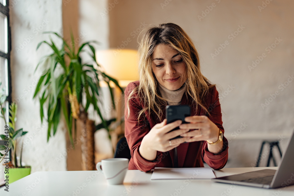 Smiling blonde girl, chatting with someone over the mobile phone. Smiling blonde girl, chatting with someone over the mobile phone.