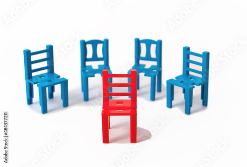 one red chair stand out of other blue. being unique and diffenent, Individuality concept. standing out from the crowd.