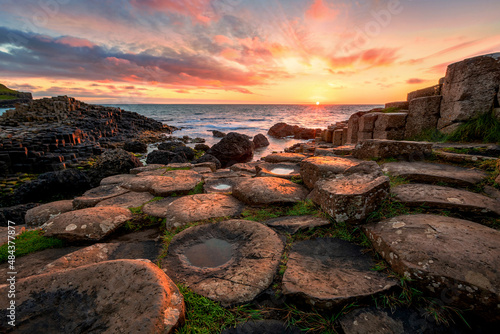 sunset over basalt columns Giant's Causeway, County Antrim, Northern Ireland photo