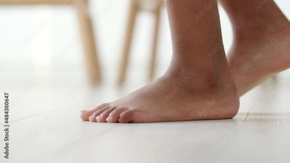 African American naked Barefoot Woman legs Walking slowly sneaking around furtively On wooden Heated Floor In Living Room at morning at home African American naked Barefoot Woman legs Walking slowly sneaking around furtively On wooden Heated Floor In Living Room at morning at home