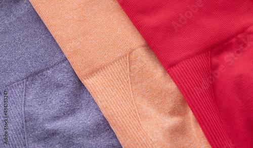 Colourful sports leggings isolated on grey background.