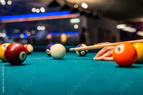 a group of young people came to play billiards and in the young hands was a cane and layers.