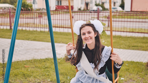 Happy Russian schoolgirl on the last day of school.