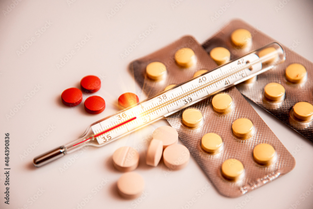 Abstract image of a thermometer with a temperature of 36.6 and drugs (Kovid, recovery - concept).