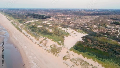 Aerial view of dunes Hollands Duin and North Sea with beach during low tide, Wassenaarse Slag, Wassenaar, Zuid-Holland, Netherlands photo