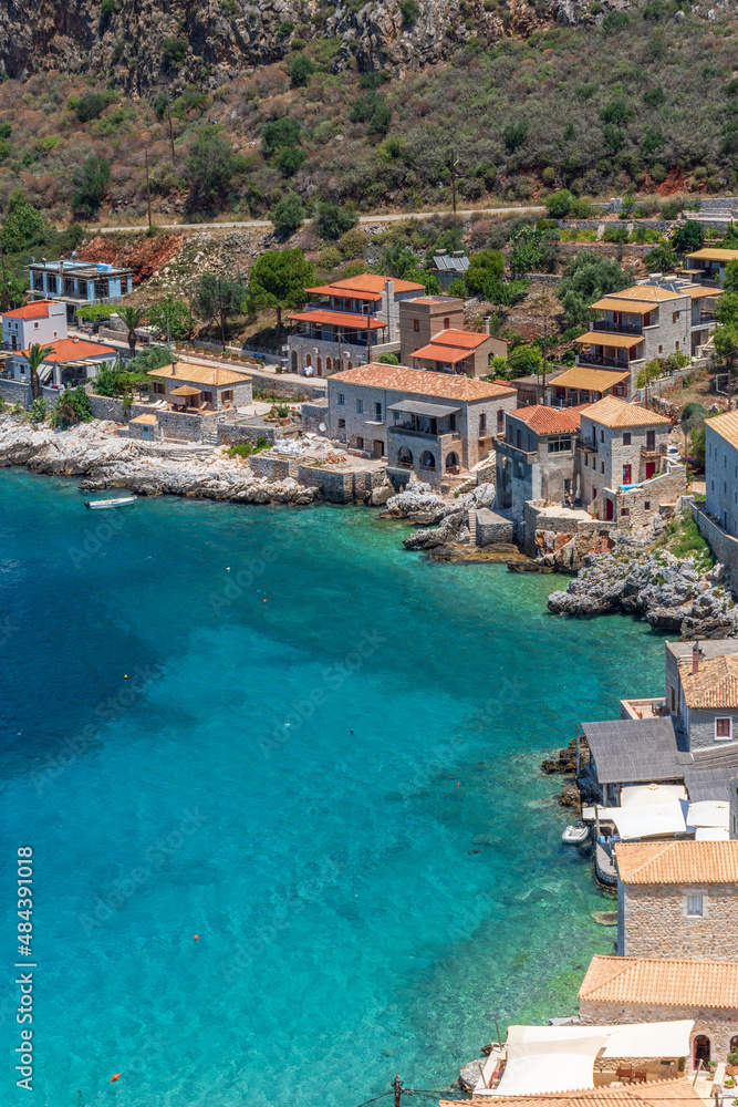 view of  Limeni village with the  turquoise waters and the stone buildings as a background  in Mani, South Peloponnese , Greece.