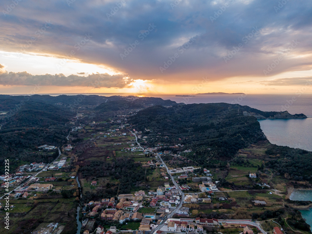aerial  drone panoramic view of peroulades with clouds in sunset time 