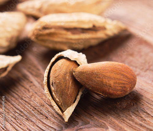 Nuts almonds on a wooden   table closeup