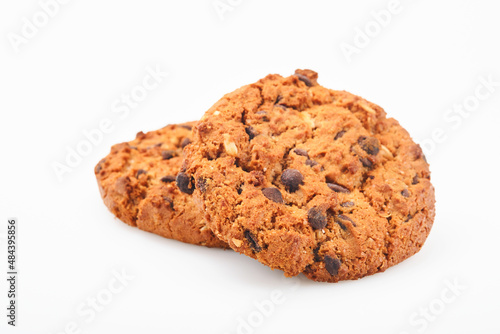 Stack of chocolate chip cookies on white background.