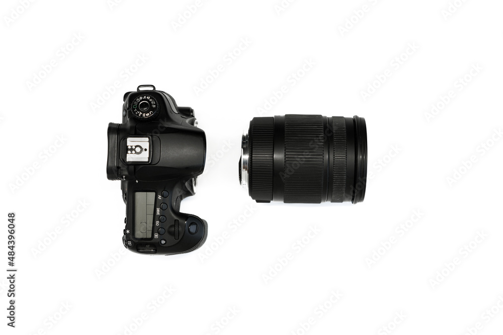 SLR camera on a white background with a set of portrait and zoom lenses top view